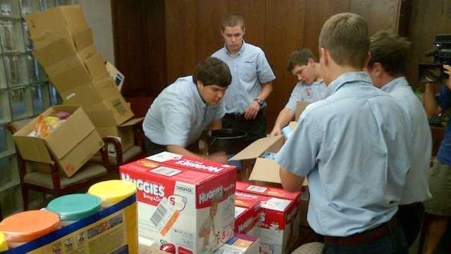 Volunteers collect and sort goods donated to the Team Braithwaite relief effort.