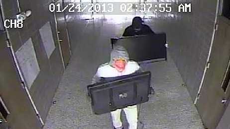 Police release surveillance photos from a burglary at Belle Chasse High School.