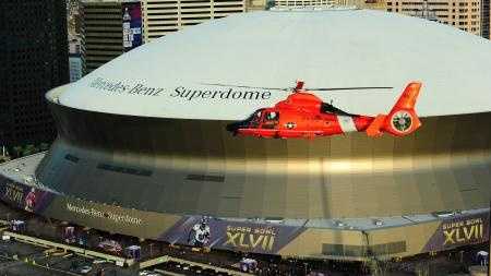 A Dolphin helicopter out of Coast Guard Station New Orleans patrols the city in the days before Super Bowl XLVII. The Coast Guard is one of 16 agencies working security for the event.