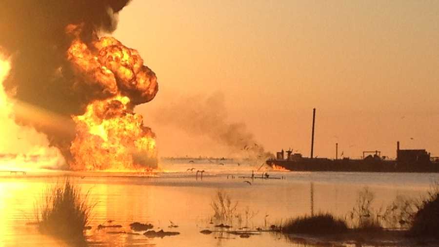 A pipeline burns after a collision involving the tug boat Shanon E. Setton, near Bayou Perot 30 miles south of New Orleans, March 15, 2013.