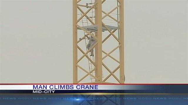 New Orleans police responded Monday morning to an incident in Mid-City after a person they call a "possible mental patient" climbed a crane hundreds of feet in the air.