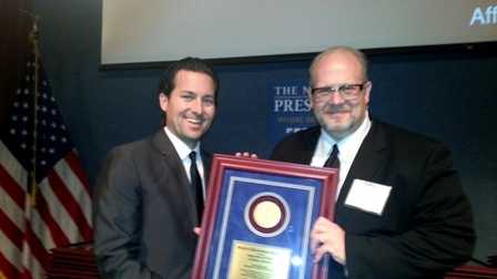 Reporter Travers Mackel and Executive Producer Keith Bliven accept the Sigma Delta Chi Award on behalf of WDSU TV.