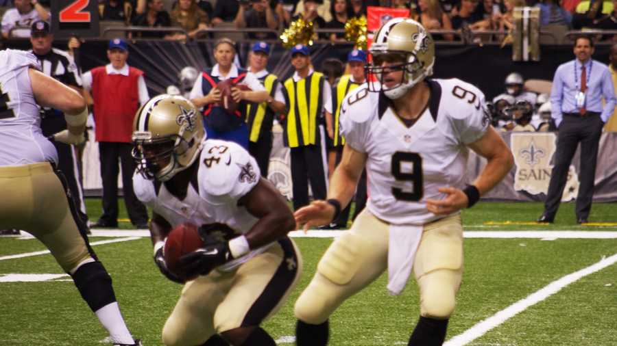 Drew Brees hands the ball to Darren Sproles in the second quarter of the Saints' pre-season win over the Oakland Raiders.
