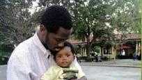 Deshawn Butler hold his son Deshawn Kinard in a photo given to WDSU by family members.