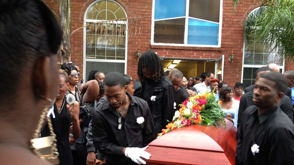 Emotional funeral held for killed father, infant son