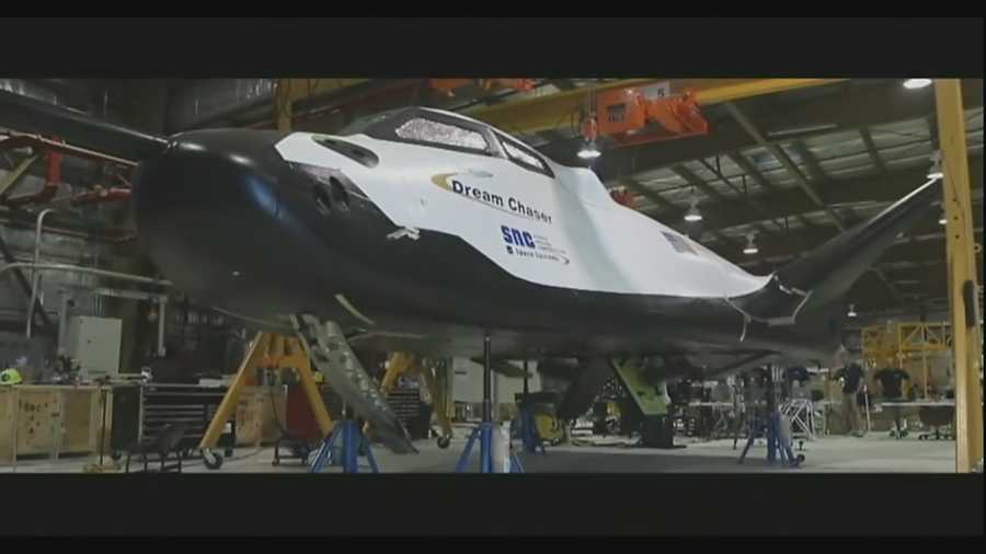 Executives with Lockheed Martin and Sierra Nevada Space Systems gave the media a look at the beginning stages of the Dream Chaser spacecraft being constructed at the site. It is one of three being built to shuttle astronauts to and from the International Space Station (ISS).
