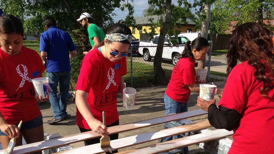 Harrah's HERO volunteers, Harrah's Employees Reaching Out, painting siding to go on the 7th Ward home of Army Veteran Terrance Johnson.