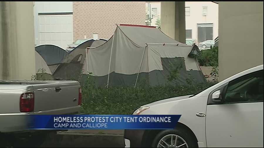 Homeless men and women gathered underneath the Pontchartrain Expressway to protest the new city ordinance against the use of tents and couches in public areas.