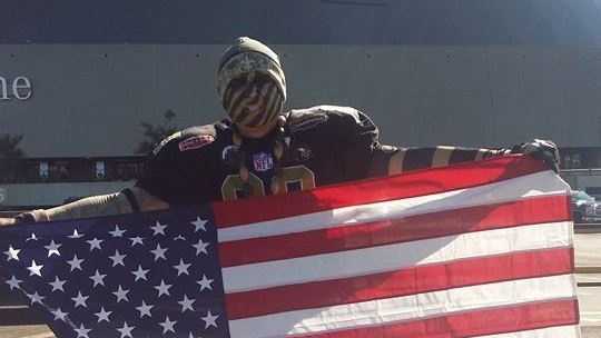 A Saints Superfan was asked to remove the American flag he hung from a railing during Sunday's game