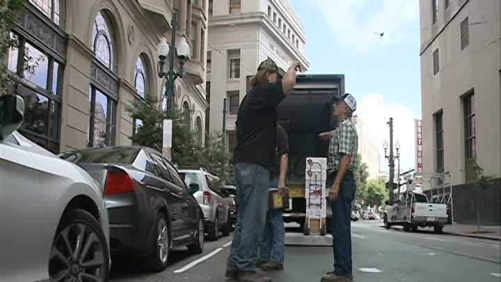The corner of Common and Carondelet streets was buzzing Tuesday with news that a massive beehive there is being moved.