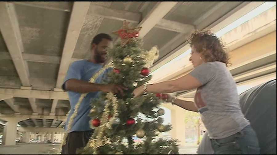 A day after city workers removed his Christmas tree, a homeless man and his friends living under the Pontchartrain Expressway have their holiday spirit once more.