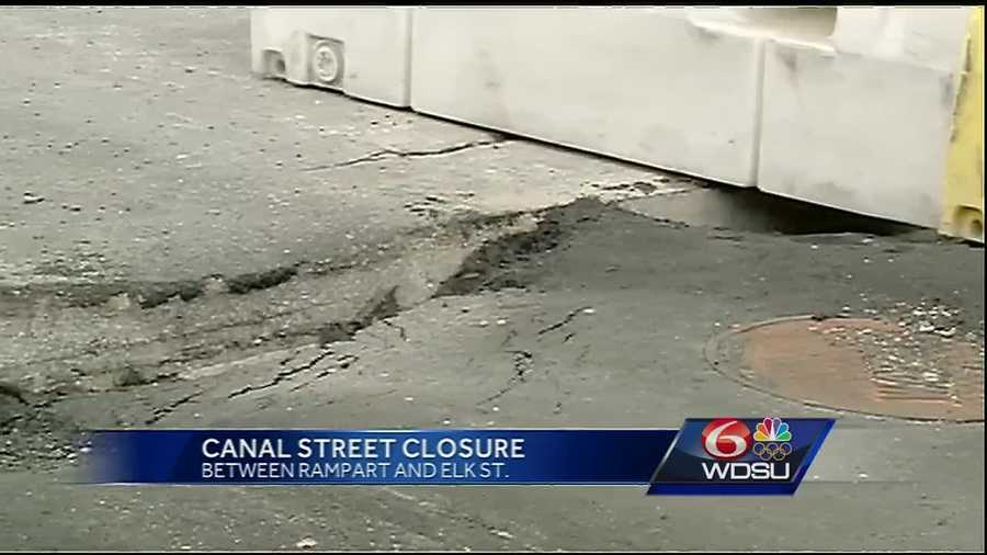 A portion of Canal Street in front of Saenger Theatre is closed Saturday as construction crews begin repairs to the sinking road.