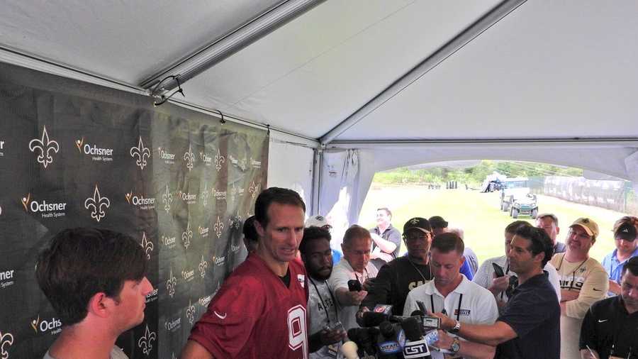 Drew Brees speaks to the media following the first full day of practice at training camp in White Sulphur Springs, West Virginia.