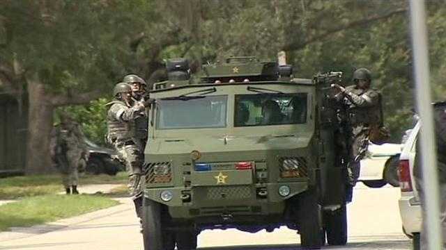 The Orange County Sheriff's Office was serving a warrant on a man when he barricaded himself in a home in Pine Hills.