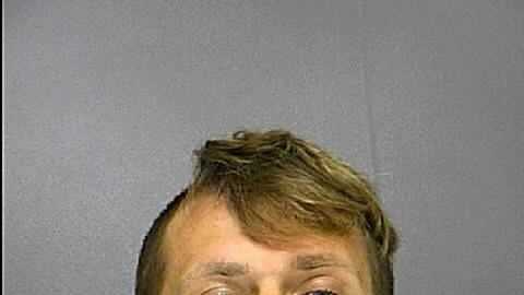 Police: Man drags officer with car