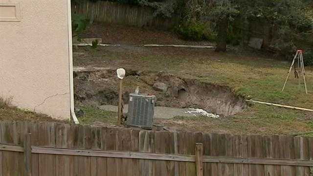 A massive sinkhole opened in the backyard of a Lake Mary home Wednesday.