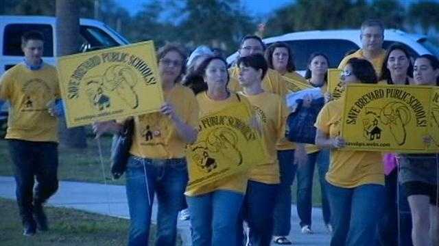 Parents in Brevard County march and protest school leader's decision to shut down four local schools.