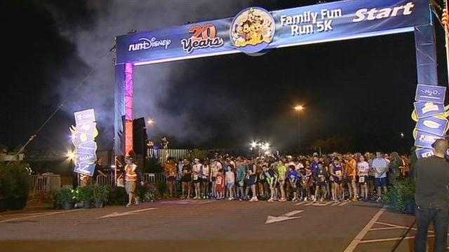 Thousands of runners take off for the Family Fun Run 5K at Walt Disney World's Epcot.