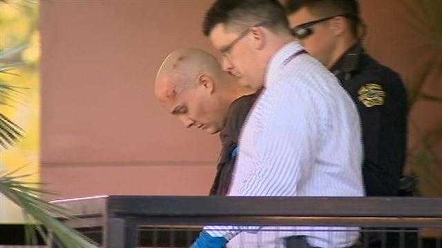 A bruised man is hauled off to jail.  Dragging his feet after being nabbed in a child sex sting!
