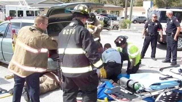 A woman was airlifted to a hospital after she was trapped under a car in Orange City.