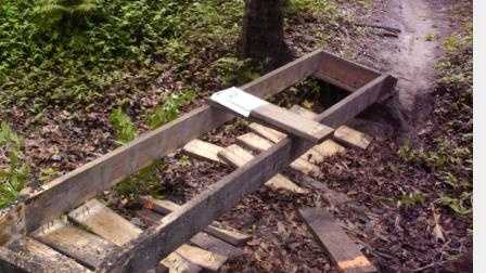Investigators say someone tore up wooden boards on six trail bridges.