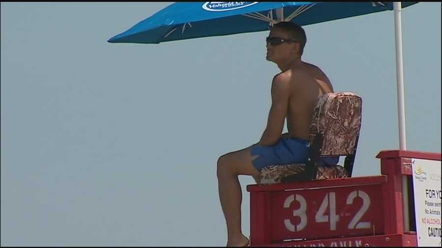 Lifeguards are warning beachgoers to swim near their towers and to be careful as dangerous rip currents continue to keep the rescuers busy.