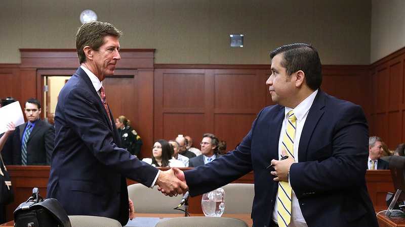 George Zimmerman is greeted by his attorney, Mark O'Mara, before the start of the 15th day of his trial in Seminole circuit court, in Sanford, Fla., Friday, June 28, 2013. Zimmerman is accused in the fatal shooting of Trayvon Martin. (Joe Burbank/Orlando Sentinel/POOL)