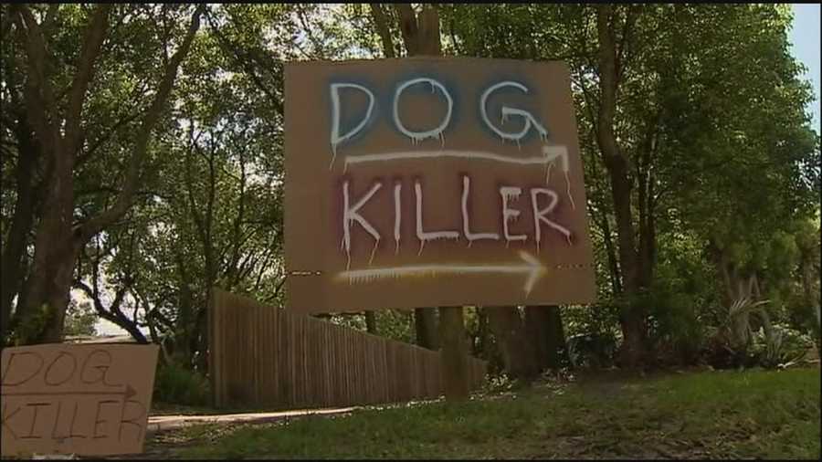 A man's dog was shot by his off-duty deputy neighbor and now he's taken to posting signs all over his property.