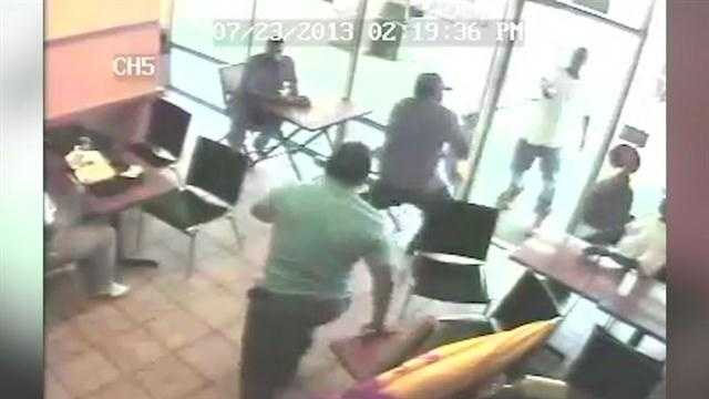 Surveillance cameras capture an armed robbery of an Orlando restaurant.