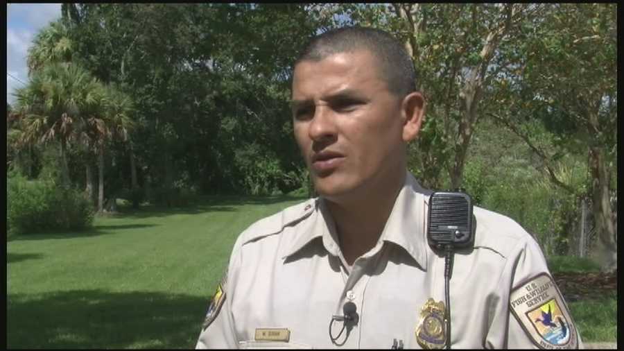 A Fish and Wildlife officer has received one of the highest honors for crawling into a burning car and rescuing a woman.