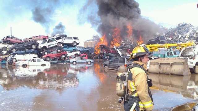 Fire at scrap metal yard sends plume of smoke into air