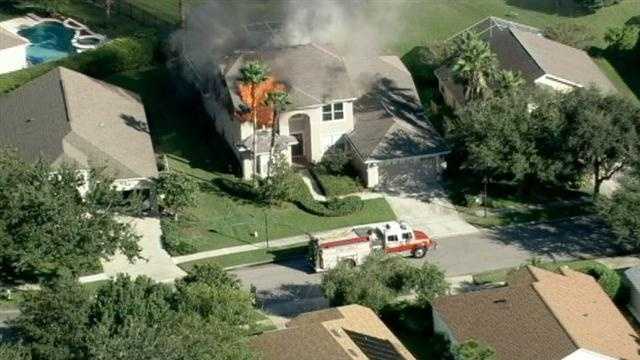 Photos: Flames shoot from Orange County home