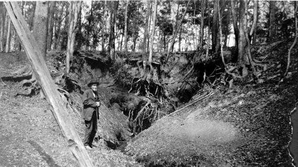 Rev. James Holland at a cascade near Jackson Bluff Road and Cascade Road, Leon County in 1920s.