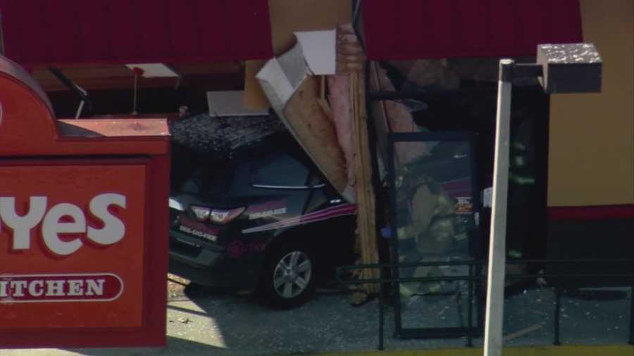 Photos: Vehicle crashes into Popeyes in Orlando