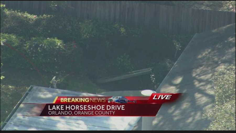 Orange County Fire Rescue officials are investigating a sinkhole off Lake Horseshoe Drive.