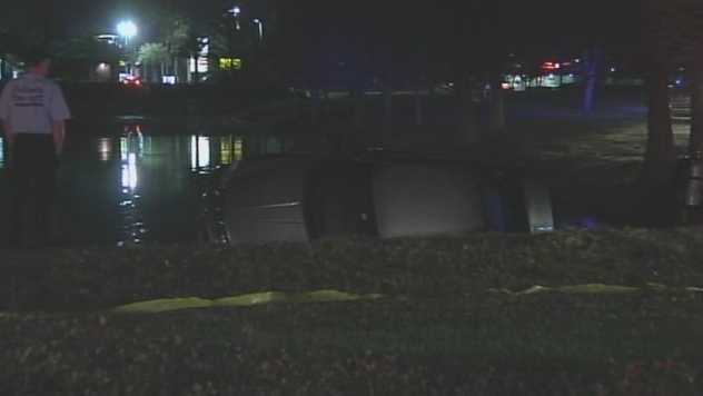 Woman rescued from sinking car in retention pond
