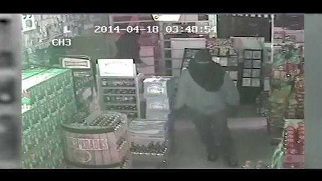 Surveillance video shows a group of burglars cleaning out an Orange County liquor store.