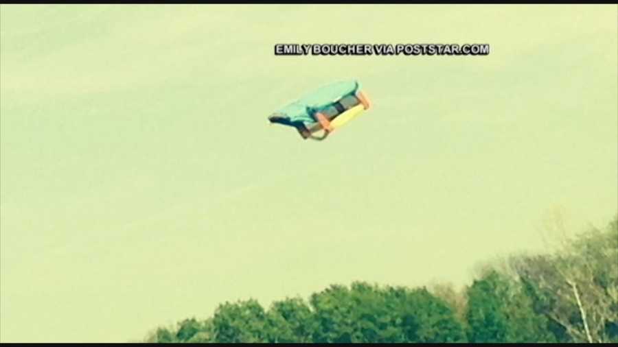 A bounce house blew away in New York with three children inside.