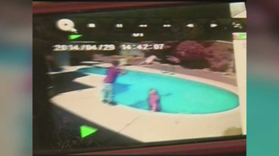 An Arizona father is facing charges after being accused of throwing his own 1-year-old into a pool, and the whole incident was caught on surveillance video.