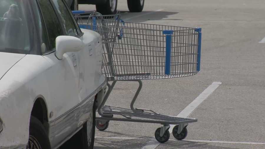 Daytona Beach police say a 66-year-old woman was briefly dragged while trying to prevent a man from stealing her purse in a Walmart shopping plaza.
