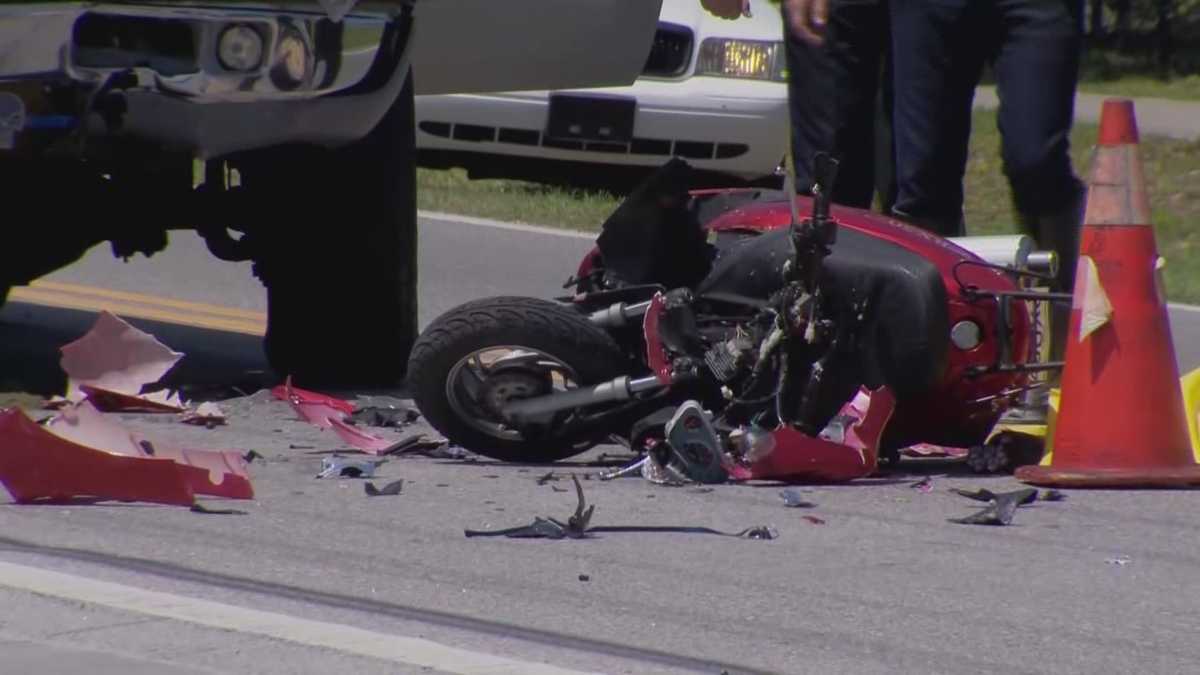 Woman dies in motor scooter crash with deputy's pickup truck