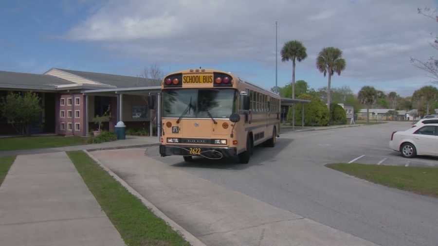 A Volusia County Schools bus monitor has been reassigned after two students came forward claiming he touched them inappropriately, police said.
