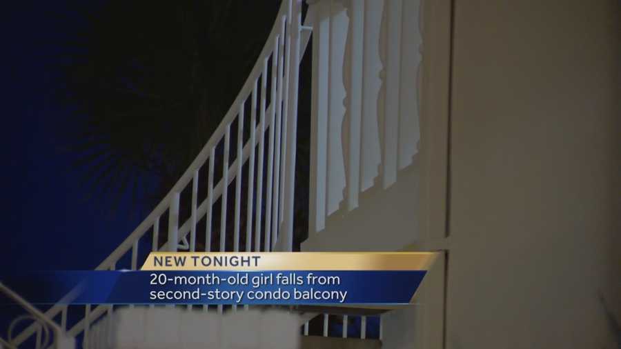 A toddler fell off a second-story balcony after climbing through the railing.