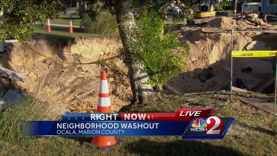 Residents in an Ocala neighborhood were evacuated after a large sinkhole opened up, possibly due to or the reason for a water main break.