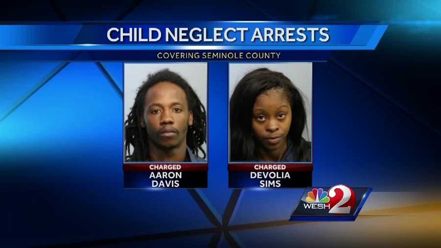 A man and woman face child neglect charges after investigators say a child was shot inside a garage in Sanford.
