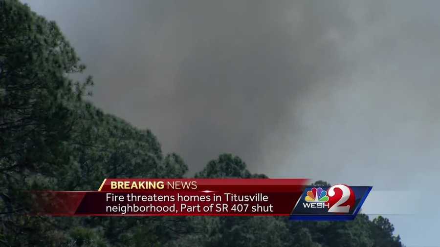 Part of State Road 407 is still shut down. Firefighters are working to keep a fire from moving toward homes in Titusville. Dan Billow (@DanBillowWESH) has the latest update.