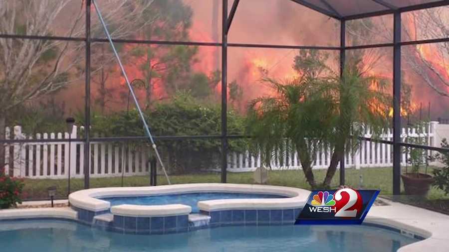 Crews battled a brush fire Monday afternoon as flames tore through east Orange County, posing a threat to some homes. Firefighters and homeowners frantically tried to get the flames out. Summer Knowles reports.