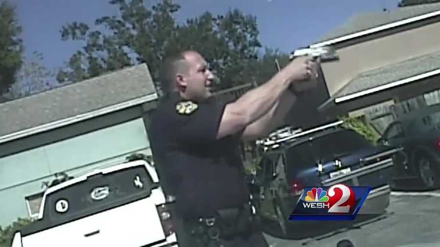 Dramatic, newly-released video shows the moment Orlando police officers were forced to open fire on a car jacking suspect.