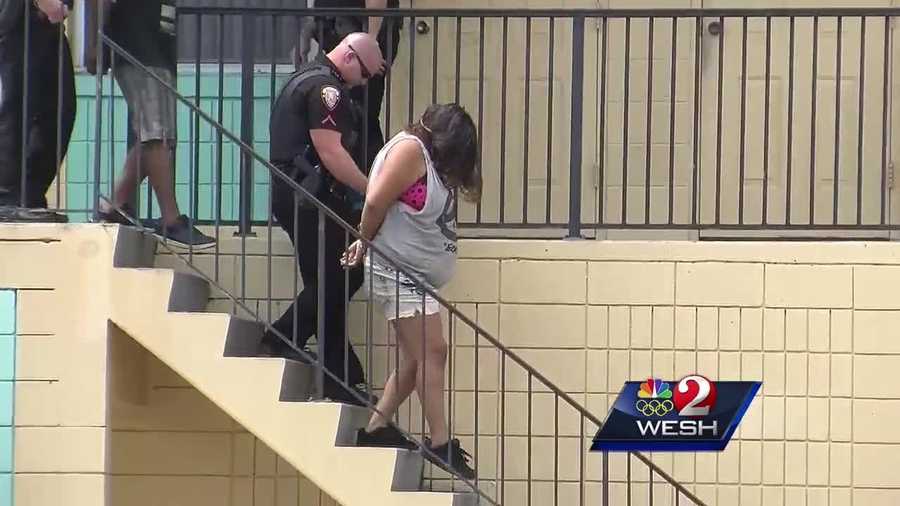 The parents of a child found wandering alone around an apartment complex in Melbourne have been arrested.