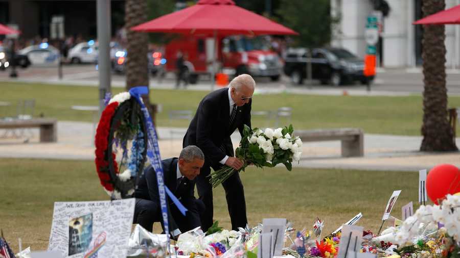 President Barack Obama and Vice President Joe Biden lay wreaths at a memorial outside the Dr. Phillips Performing Arts Center